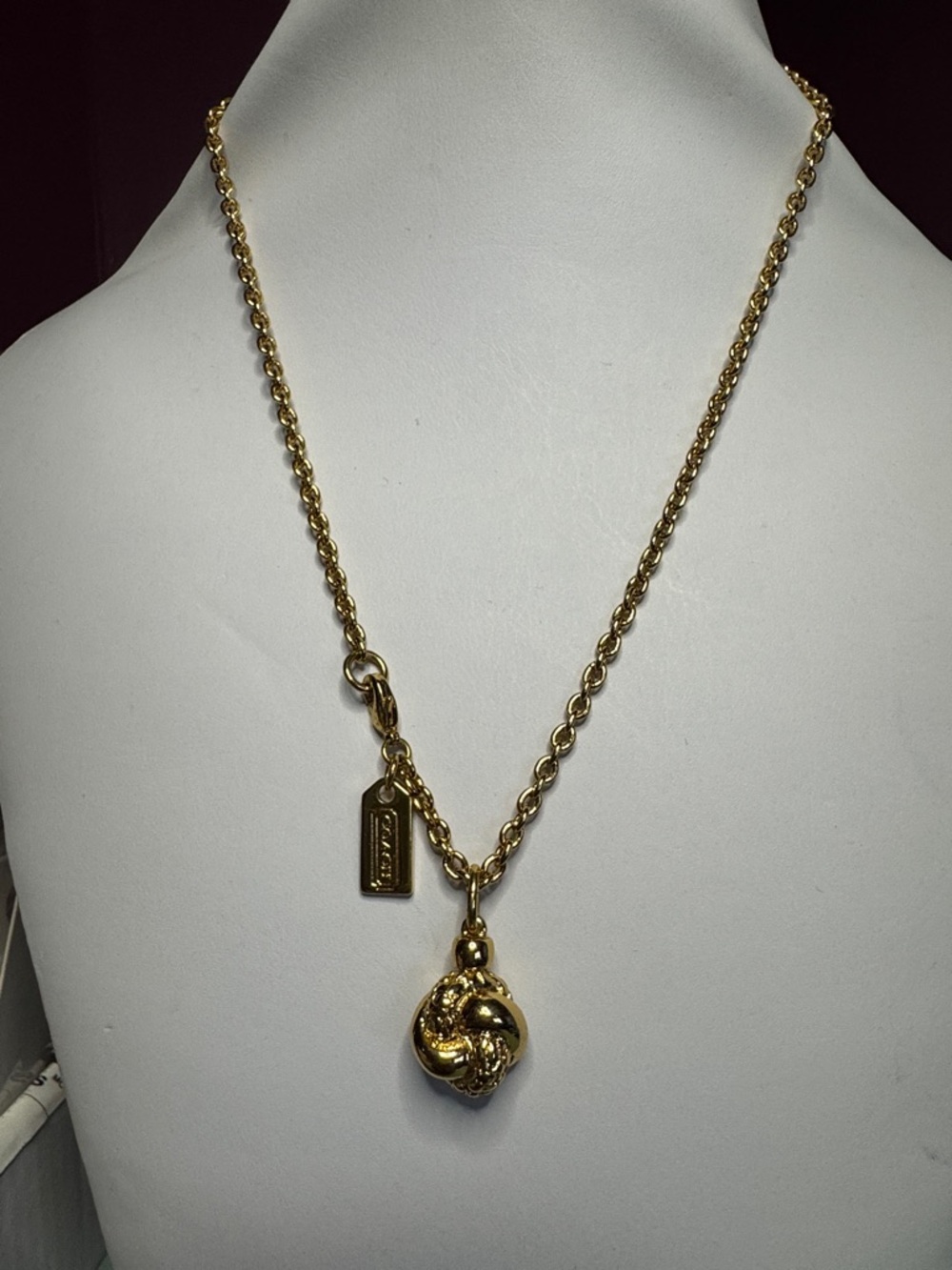 COACH Gold Knot Charm Necklace